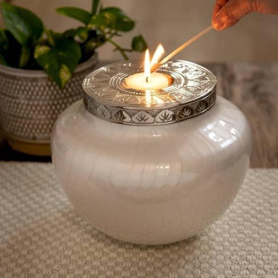 Large candle Cremation Urn for Ashes Adult being lit